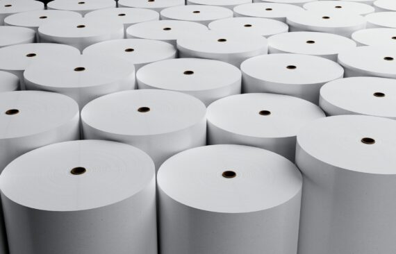 Group of white paper rolls in industrial factory for storage background. Production and manufacturing concept. 3D illustration rendering